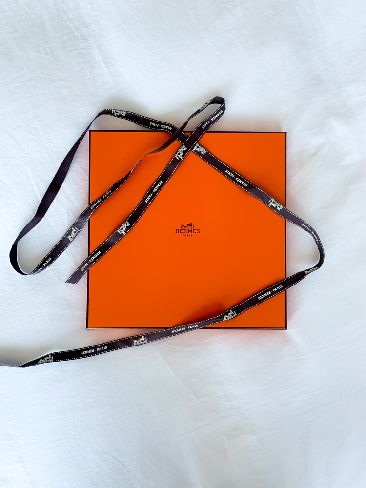 A SILK HERMES SCARF IN THE ORIGINAL BOX - OF RECENT PRODUCTION