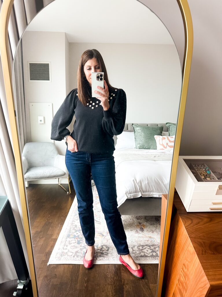 Woman wearing Tieks ballet flats with jeans, highlighting their versatility for casual or formal wear.